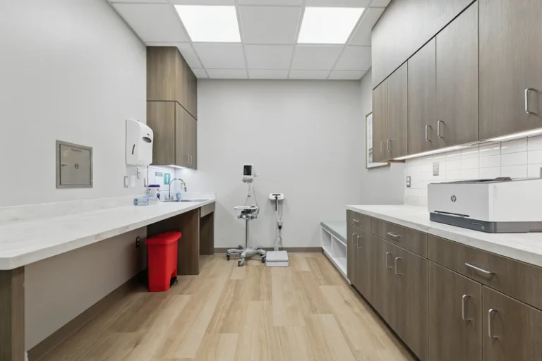 Clean, modern examination room with equipment.