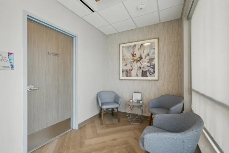 Waiting room with three chairs.