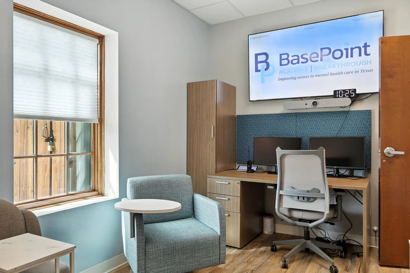 basepoint breakthrough forney young adult mental health facility group counseling room gray with tv and desk