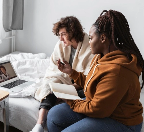 woman taking notes from her friend s doctor
