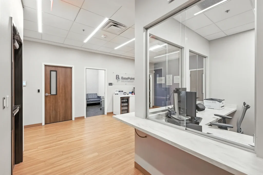 Administrative reception window and hallway inside a young adult treatment center