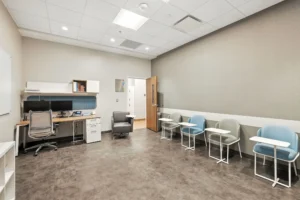 Empty modern group therapy room with seating