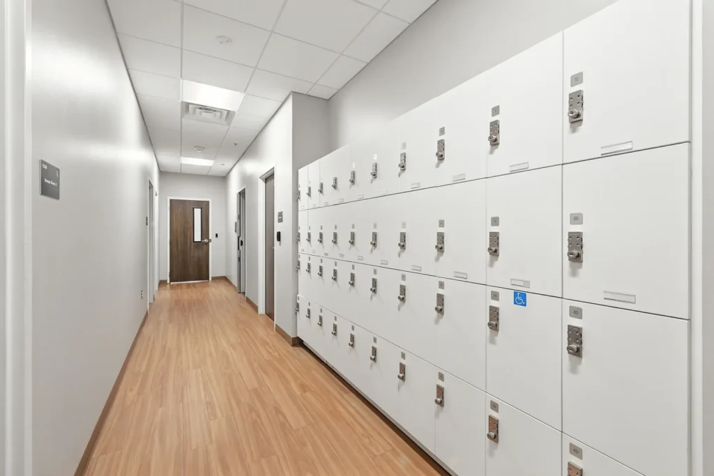 Long hallway with white lockers