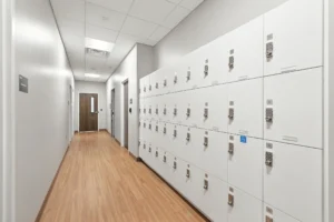 Long hallway with white lockers