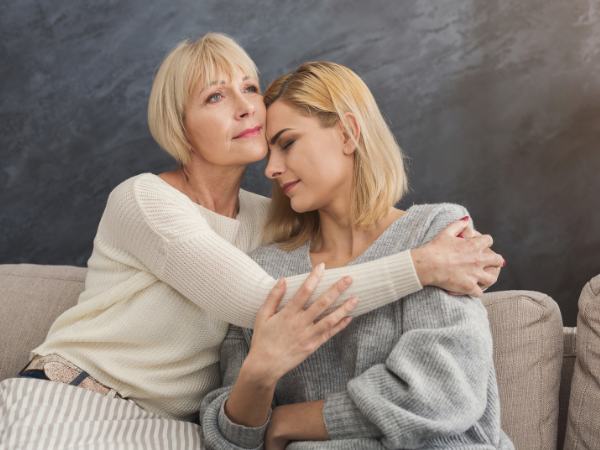 A mother supports her daughter who is experiencing a mental health crisis